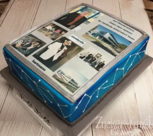 Rechteckige Abschiedstorte für das Swoboda-Schorndorf-Team mit einer Foto-Collage, Firmengebäuden und blau-weißem Netzmuster.