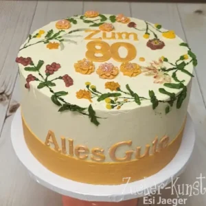 Geburtstagstorte Frau: Torte zum 80. Geburtstag, dekoriert mit filigranen Blumenranken und goldenen Akzenten. Elegantes Design für Frauen.