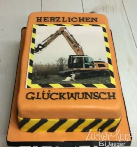 Witzige Geburtstagstorte Mann: Bagger-Design mit Warnstreifen und Foto-Print.