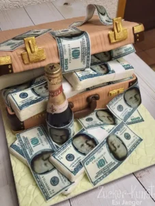 Ausgefallene Geburtstagstorte für Männer: Geld-Koffer-Design mit essbaren Scheinen und Sektflasche.