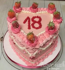 Geburtstagstorte Teenager: Rosa Herztorte mit Erdbeeren zum 18. Geburtstag.